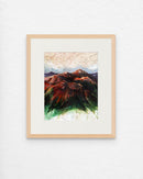 Framed artwork of a mountain landscape with a colorful abstract design.