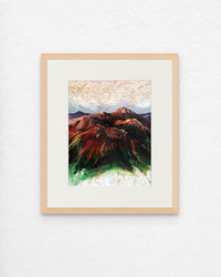 Framed artwork of a mountain landscape with a colorful abstract design.