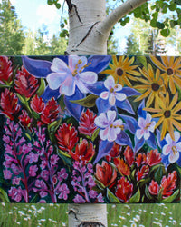 Colorful floral painting with a natural background of trees and greenery.