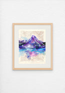 Framed artwork of a mountain landscape with watercolor effects on a white wall.
