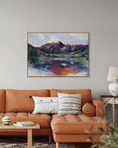 Living room with a brown sofa, decorative pillows, and a colorful mountain landscape painting on the wall.