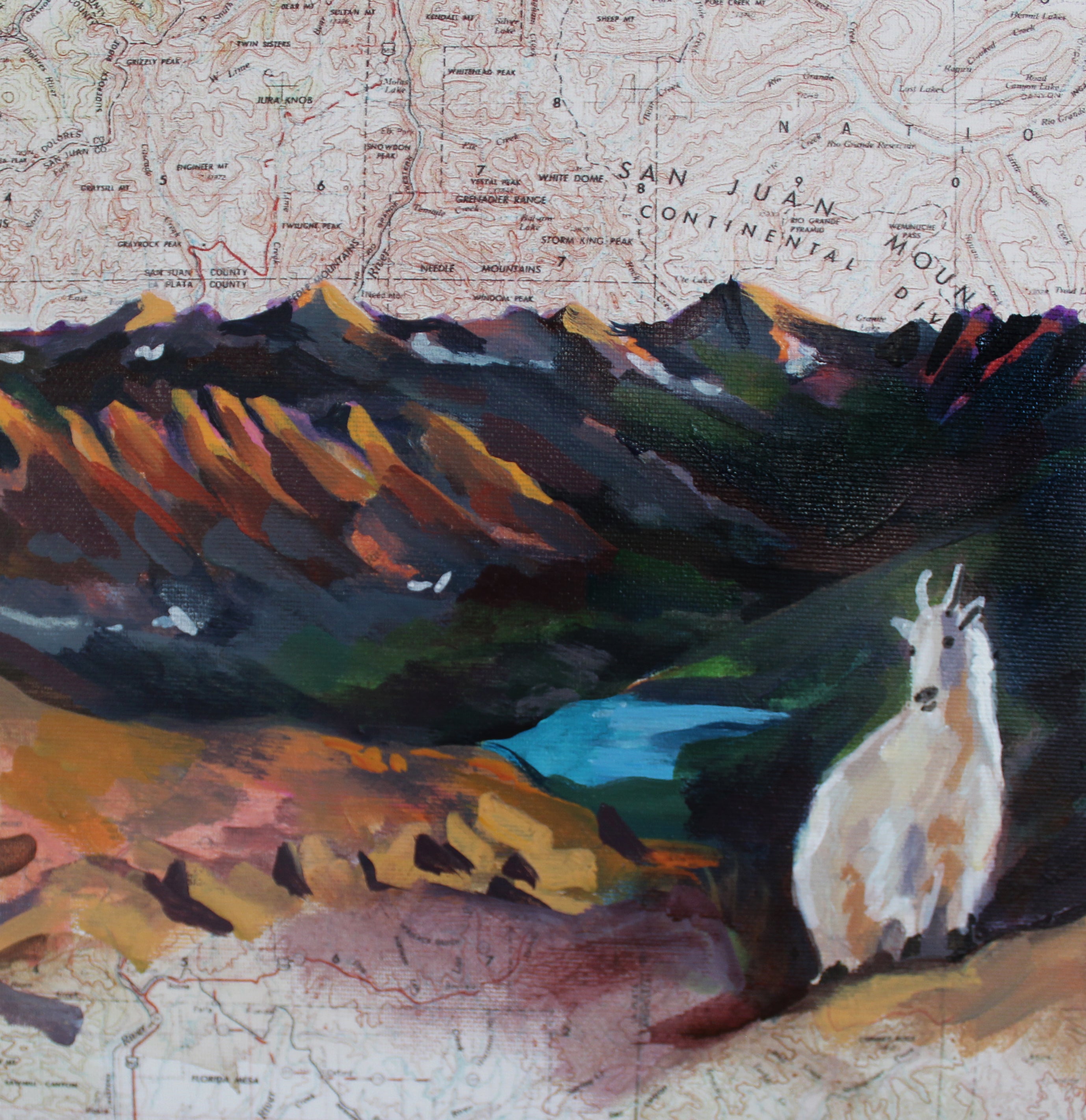 Colorful mountain landscape with a goat on a map background