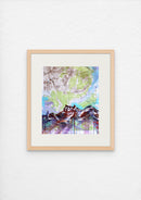 Framed abstract artwork on a map with colorful landscape design on a white wall
