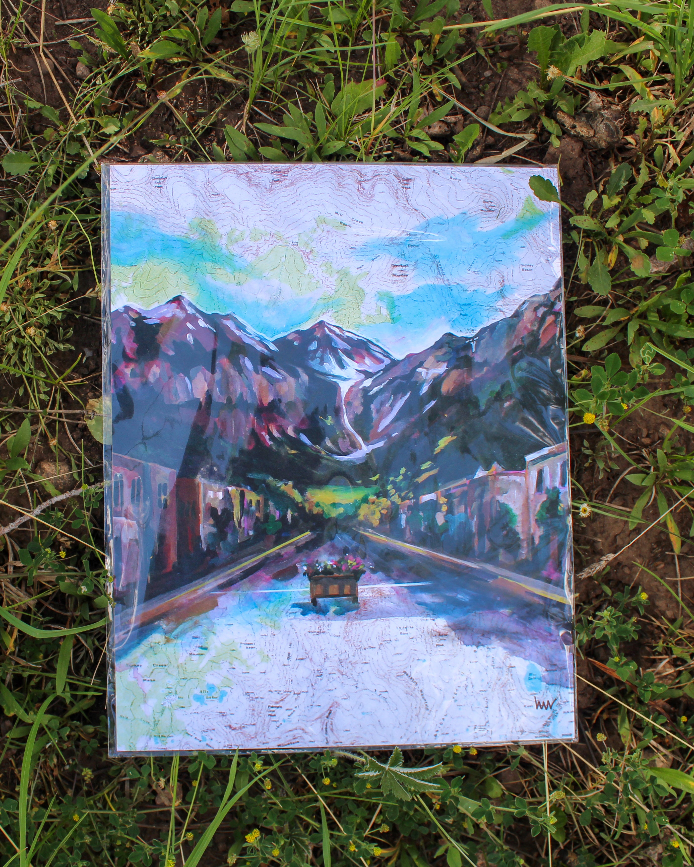 Painting of downtown Telluride Colorado with mountains in the background. 
