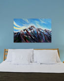Painting of a mountain on a blue wall above a bed.