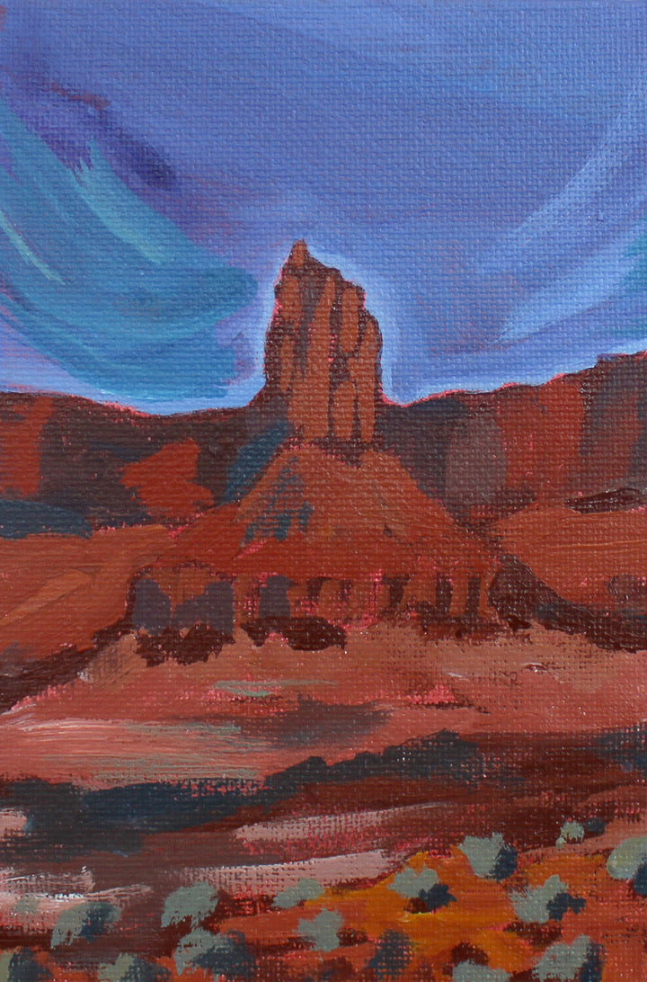 Painting of a desert landscape with a prominent rock formation under a blue sky.