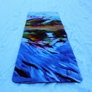 Mountain painting on a yoga mat sitting on the snow